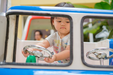 Asian Cute baby girl playing with toy. Portrait of Asian beautiful baby girl of 1 year and 3 months old.