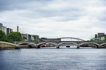 Fototapeta na wymiar Beautiful view of vintage bridge and river in city