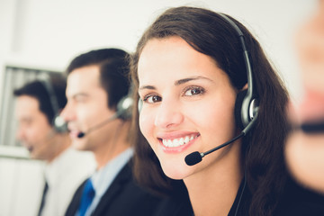 Beautiful smiling woman working in call center