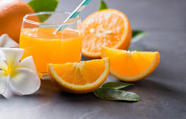 Fresh sliced orange and orange juice