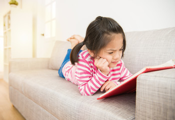 girl reading story book feel difficult
