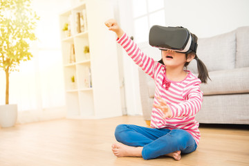 girl in virtual reality glasses playing game