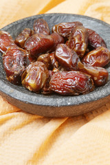 Dried dates in small bowl