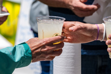 Lemonaide being handed to a customer at a food truck festival
