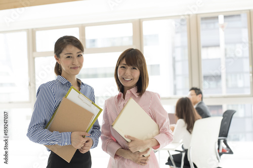 smiling faces of working women portrait fotolia com の ストック写真
