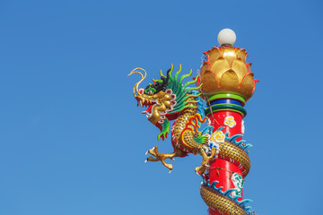 Chinese dragon statue with blue sky
