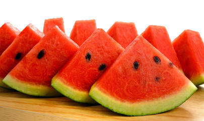 slices of watermelon on wooden table. selective focus