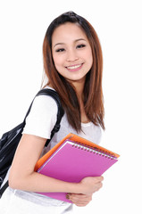 Young girl smiling with backpack ,holding book-white background