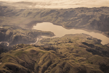 Aerial view of rolling hills in California with fog