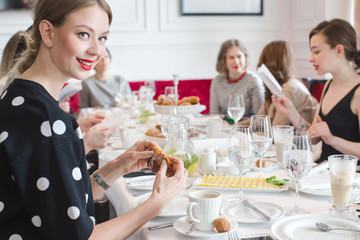 Group of women celebrating in restaurant