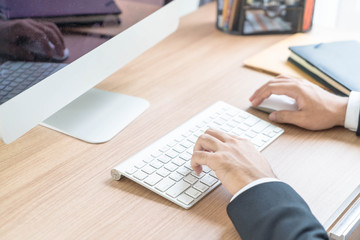 Close-up hand of businessman using computer