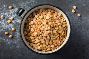 Uncooked Yellow Split Peas in a Metal Cup