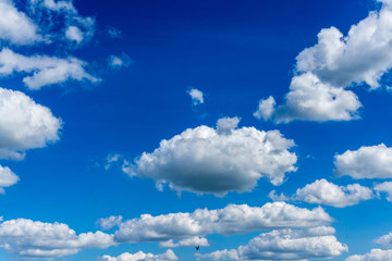 Naklejka na ściany i meble Blue sky with clouds at sunshine