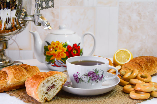 Tea from a samovar with sweet pastries. Selective focus
