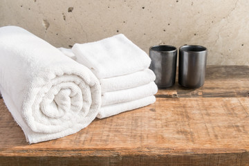 Obraz na płótnie Canvas Stacked white spa towels