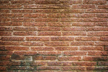 red brick wall texture grunge background with vignetted corners