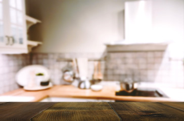 Wood table on blur Interior of kitchen background