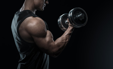 Fototapeta na wymiar Close-up of a power fitness man doing biceps workout