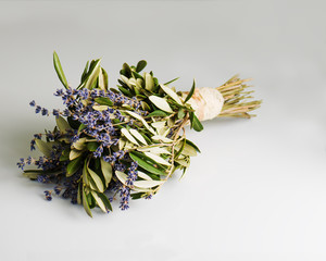 Romantic bouquet of Lavender flowers and Eucalyptus leaves in retro style on gray background. Shallow depth of field.