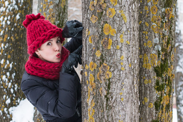 Cute girl in a warm hat in winter