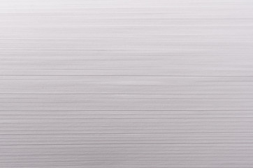 Striped smooth soft white texture with thin parallel streaks.