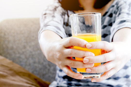 Woman holding glass with tasty juice - Healthy Lifestyle