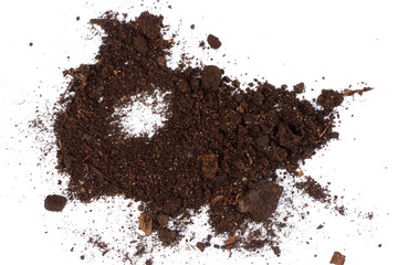 Soil, ground, brown land isolated on white background. Organic gardening, agriculture. Nature closeup. Environmental texture, pattern. Mud on field.