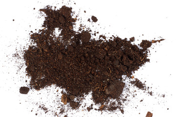 Soil, ground, brown land isolated on white background. Organic gardening, agriculture. Nature closeup. Environmental texture, pattern. Mud on field.