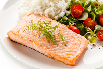 Roast salmon with white rice on white background
