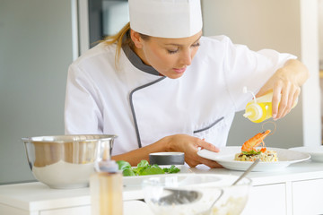 Chef preparing dish in professional kitchen