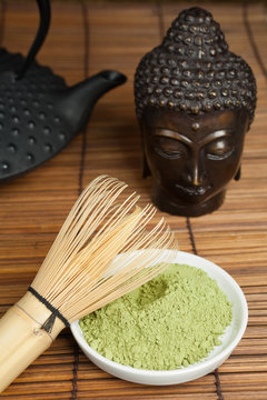 Buddha bronze with green tea