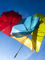 many colorful umbrellas on blue sky