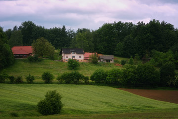 Obraz premium Rural alpine landscape with slovenian village in valley near Bled lake at spring sunny day. Slovenia.