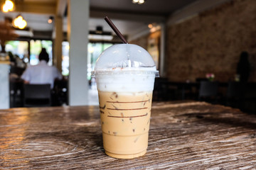glass of ice coffee on the wood table