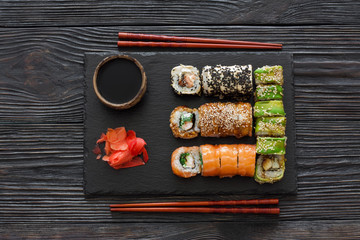 Set of sushi served on a stone slate