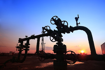 In the evening of oilfield pipeline silhouette