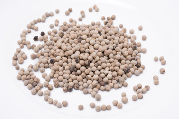white peppers in white plate on the white background