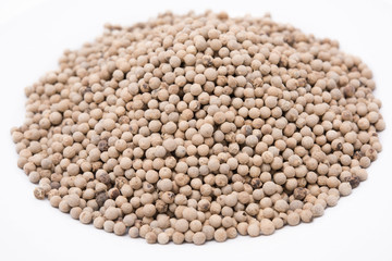 white peppers in white plate on the white background