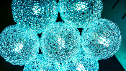 Lighting balls hanging from the ceiling on background