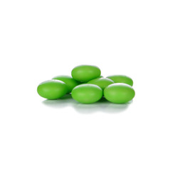 Green pills isolated on white background