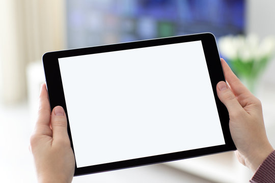 Female hands holding computer tablet with isolated screen in room