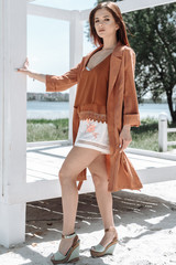 Summer fashion portrait of a beautiful young woman or girl on the beach