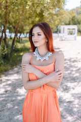 Summer fashion portrait of a beautiful young woman or girl on the beach