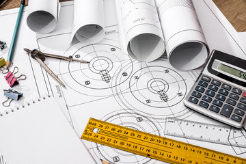 Engineering drawings with calculator, ruler, compass and pencil