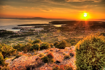 Sunset over the island and city of Rab in the Adriatic sea, Croatia