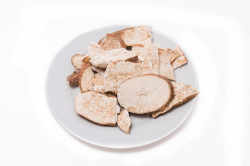 Dried cassava in white plate on the white background