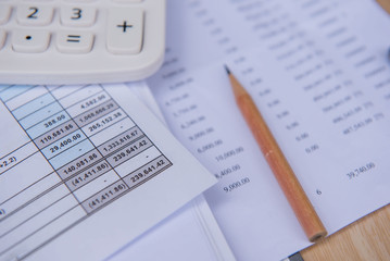 closeup accounts number on a printed paper ,Calculator and pencil. finance business sheet . 