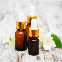 Fototapeta na wymiar Massage oils and jasmine flowers