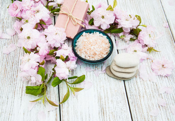 Obraz na płótnie Canvas Spa products with sakura blossom