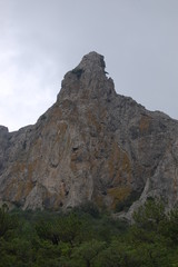 Fototapeta premium A majestic rock against a gloomy sky
